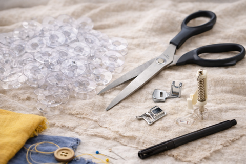 Bonus Items -  Assorted feet, scissors, clear bobbins and fabric marker Total Value $129.95